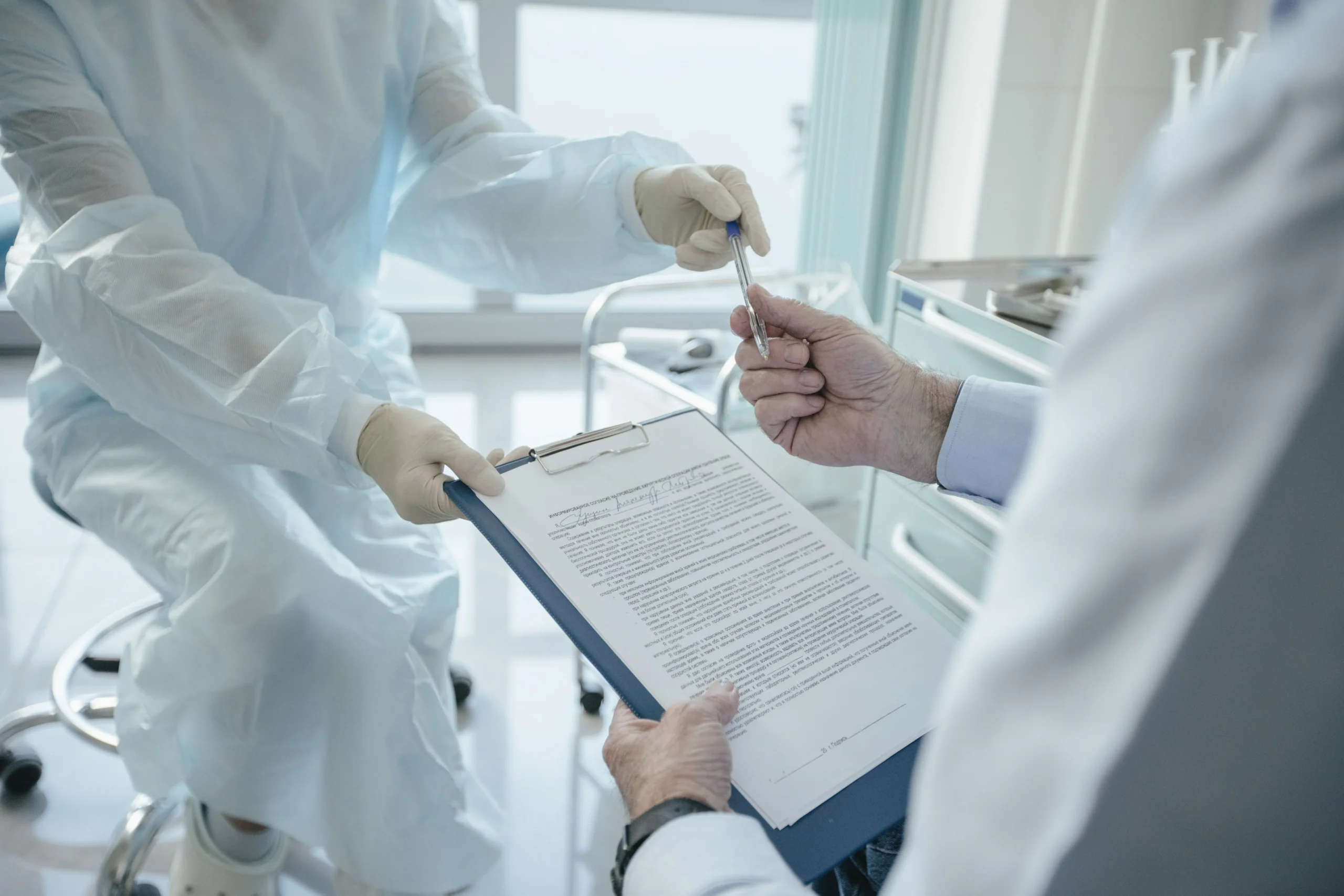 Medical documents reviewed before confirming a blepharoplasty quote.
