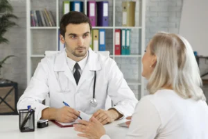 Patient discussing blepharoplasty costs and suitability during a consultation.
