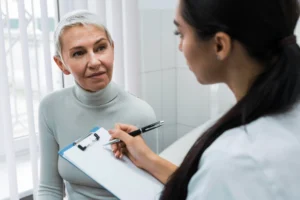 Patient discussing facelift options during a clinical consultation.