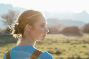 Woman in side profile showing natural facial and nasal proportions.